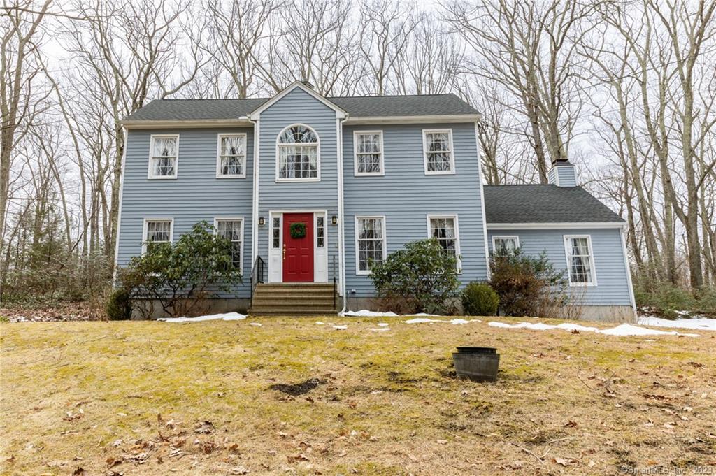 This stately four bedroom, two-and one-half bath Colonial is located adjacent to the Flanders Nature Center and offers stunning natural surroundings and privacy galore. Situated on 3.78 park-like acres, this property is beautifully landscaped featuring a gorgeous rock wall and surrounded by mature trees. Enter through the open foyer, and the traditional colonial floor plan offers a home office for hybrid work-from-home options and a large formal dining room. The open kitchen allows for an eat-in area with plenty of space for a table and a cutout to the enormous great room so as to not miss out on family gatherings while preparing a feast. The four-season sunroom adjacent to the kitchen features vaulted and beamed ceilings with ample natural light and doors on either side leading to two large outdoor multitiered decks. The expansive great room features vaulted and beamed ceilings, a stately brick fireplace and French doors leading to one of the two decks. The main level continues with a half bathroom, laundry area and a bedroom that could double as additional home office space depending on your needs. Upstairs, the master bedroom features a private sitting area, ample closet space and a private shower/water closet. Two additional spacious bedrooms complete the upstairs along with an additional full bathroom with double sinks. This home sale is subject to probate approval.