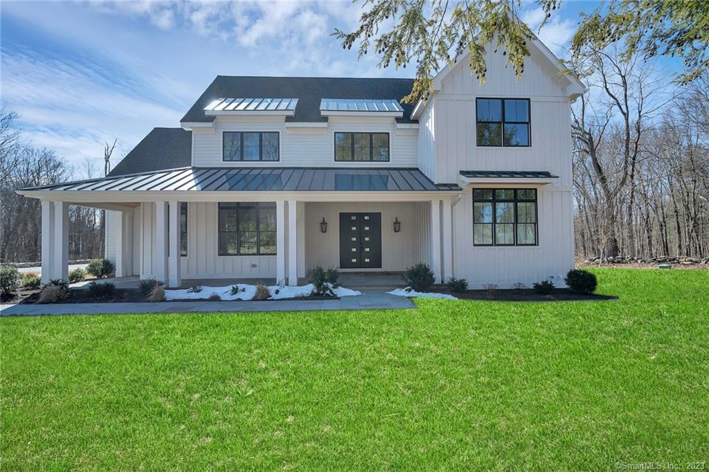 New, custom built modern farmhouse with 1st floor primary BR, less than a mile from Ridgefield's Main St! No detail was overlooked in this special 4BR/3.5BA home that boasts superior finishes, sophisticated touches, state-of-the-art features & an abundance of natural light. Gorgeous stone wall and inviting front porch first welcome you to 134 Branchville Rd. Step inside the double front doors to the 2-story sun-filled family room, which features gas fireplace, built-ins & sliders to covered deck. It flows effortlessly to the kitchen for a true open concept feel. Kitchen offers function and style w/ white custom cabinetry, gorgeous quartz counters, 8 burner gas range, wall oven & beverage fridge. Just off the kitchen is formal DR w/ exquisite chandelier & beautiful barn door, a study & an oversized laundry/mudroom. Main level primary suite features 2 walk-in closets & luxurious bath with heated floors, double vanity, walk-in shower, freestanding tub, & another exquisite chandelier. Upper level has 2 BR that share a bathroom, & 3rd BR has access to hall bath. All bedrooms have walk-in closets. There is an additional 700 SF on the upper level that is framed and ready to finish. The 2200 SF basement, with 8 ft ceilings, offers numerous options for even more space. The home is sited on two acres that borders open space and is already sited for a pool. Full house generator, Pella Thermopane windows, hardwood floors & 9ft ceilings throughout. Too many details to mention -- must see!