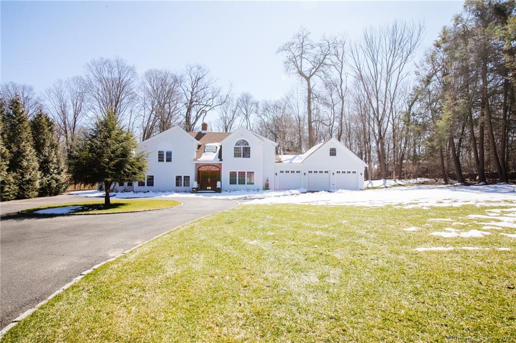 Stunning driveway entrance to generously sized Contemporary/Colonial in private Northern Stamford neighborhood. This 5 bedroom home boasts a newly added 3 car garage, renovated kitchens in both main and in law sections of home, open floor plan, and plenty of living space. Enjoy the safety and quiet of a private neighborhood ideal for daily walks, while still having close access to Cascade Rd for a quick route to Merritt. In law suite occupies 2 floors with private access, updated kitchen, wet bar, and living room.