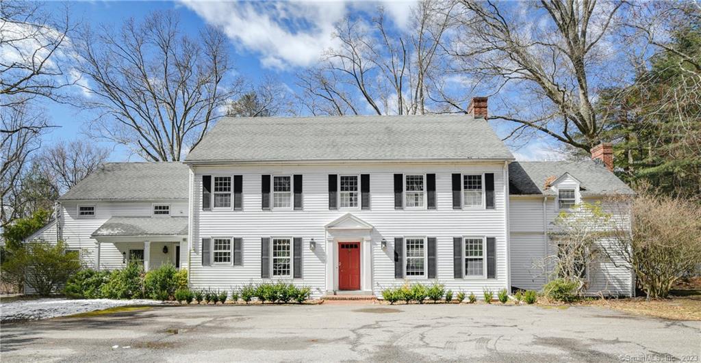 Nestled on a sprawling 4-acre lot in Darien, Connecticut, stands a charming Center Hall Colonial built in 1961. The impressive front-to-back foyer, high ceilings, and superb flow create an interior that beckons you to explore every room. This house boasts five spacious bedrooms and five full bathrooms, making it ideal for those who love to entertain. The house is available as-is, the potential for a cosmetic renovation is quite promising, with the wide-open spaces, and the expertly crafted structure allowing for personalized and modern updates to be made with ease. Bring your design dreams to fruition and create the space that truly resonates with you. As you step outside to the gorgeous 4-acre lot, you will discover a private property, set back from the road, that ensures maximum privacy. The circular drive leads you to the house with ease and the swimming pool at your disposal will make the hot summer months all the more enjoyable.