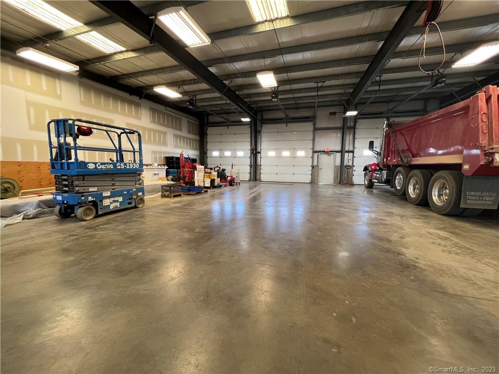 Three bay Warehouse with automatic garage doors that can be used as storage or a workshop. Featuring gas heat- 3, 520 sqft. Ceiling height is 14 ft. Private bathroom and running water. Outside canopy area 1, 216sqft that can be used as storage. Close to all major highways. Secured yard with gate access.