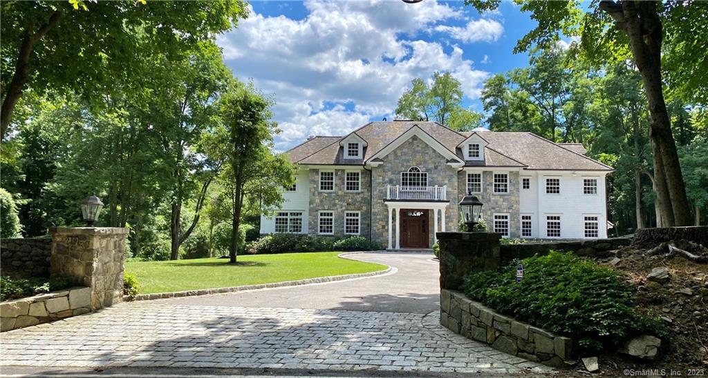 Premier Georgian Estate set on 4 private bucolic acres, surrounded by historic stone walls, bordered by preservation land & riding trails. This magnificent custom-built home, designed by award winning architect has a grand entrance foyer that boasts 24' ceilings, a sweeping staircase & calacatta marble floors. There is stunning detailed millwork, coffered ceilings & architectural details. Impeccable chef's kitchen w/marble island, countertops & backsplashes, Subzero & Viking appliances. Luxe primary suite w/ marble fireplace, sitting room/office, 2 walk-in closets, spa-like bath & balcony overlooking the wonderful property. 25' ceiling 3rd fl. Manicured level grounds, heated pool & spacious deck, perfect for entertaining. 2-stable horse barn or 6 additional garages, great for a collector.