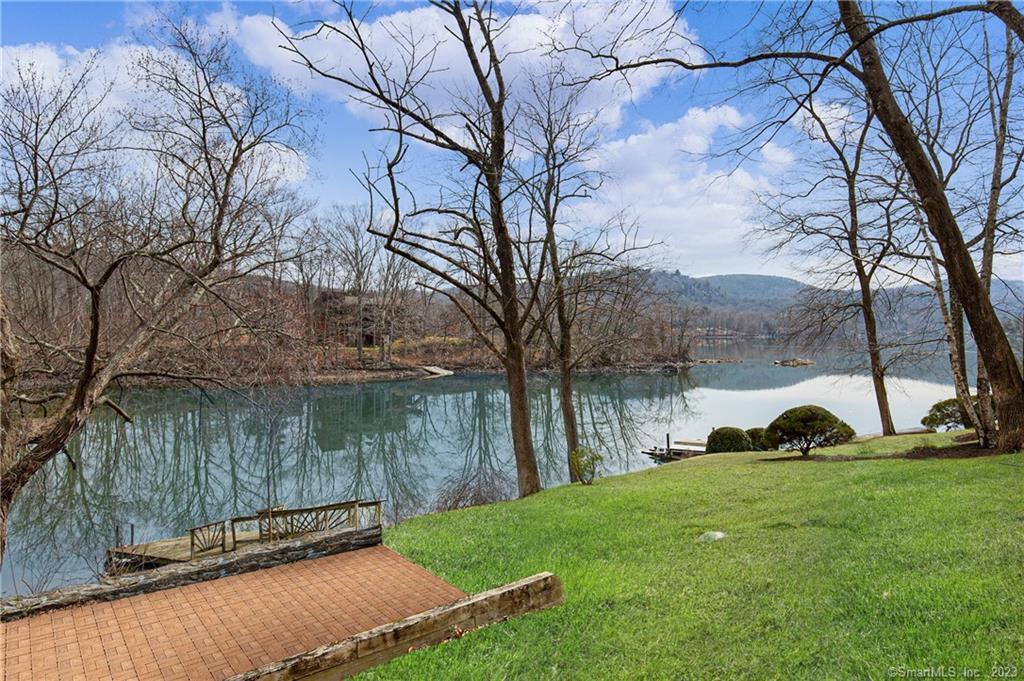 A rare DIRECT WATERFRONT home on Candlewood Lake in the highly desirable Town of Sherman just became available. Escape from the hustle and bustle to this tranquil and amazing lake town for amazing swimming, boating, and fishing. Close enough to the city or work from home from your deck overlooking the water, this home offers everything your heart desires. Enjoy the local ambiance such as the local winery, great restaurants, golf course, and hiking trails that go on for miles. Your personal dock offers you quick access to every part of Candlewood Lake via your kayak or motorboat. More amenities than we can mention in this great community...Enjoy all the perks of Deer Run Shores lake community membership which includes a BOAT SLIP, use of the clubhouse, pool and beach. CENTRAL AC | PRIVATE BEACH | BOAT DOCK & ADDITIONAL BOAT SLIP | CLUB HOUSE | SWIMMING POOL | FRESHLY PAINTED | AMAZING VIEWS