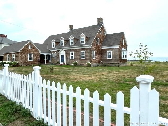 SUMMER AT THE BEACH! Your very own private, sandy beach! Charming Cape-style house on almost 1 acre allows plenty of room for enjoying outdoor activities in wonderful Sachem's Head. House is newly renovated - new kitchen/baths/many additional updates. Has office/library for work from home and an enclosed porch. Water views from every room. Outdoor patio faces Long Island Sound - views of Faulkner Island and Long Island in the distance. Great bird watching...or just relax and enjoy the ever changing colors on the water and rocks. Kayaks and paddle board available, as well as great swimming. Walk to tennis/paddle tennis courts and pickle ball. Great walking and biking in this beautiful neighborhood. 3.5 miles from Guilford center with wonderful restaurants and shops, and train to NYC (90 miles). House can sleep 11 comfortably. Master suite has king bed; two other queen sized bedrooms (one on first floor). Owner/broker. Listing is for Aug 1 through Aug31, 2023