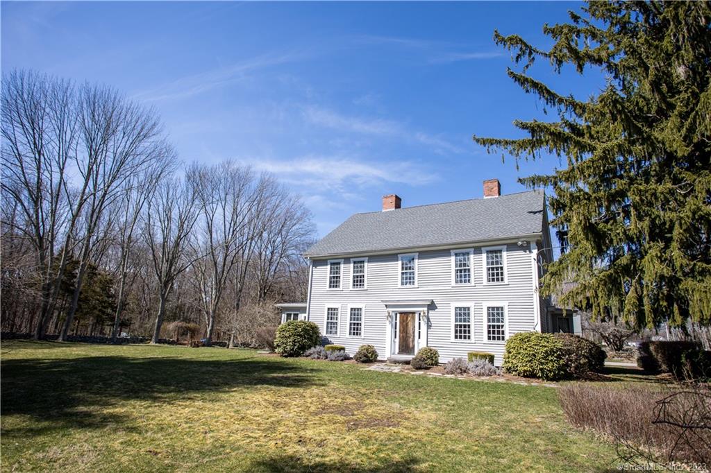 Wonderful fully restored antique Colonial in the country in historic Norwichtown. Set on over 3 acres of lawn, woods, and stonewalls. Plenty of space for a pool and sports activities. Enjoy the beautiful landscaping from the stone patio: a rose garden, 3 gardens blooming with perennials, mature lilacs, and a honeysuckle-covered pergola. This 18th Century house retains many original features including a gracious center-hall floor plan, 4 fireplaces, wide floorboards, and raised paneling. Extremely well maintained: 2022 roof, exterior painted in 2022. Updates include Central Air Conditioning, 3 zone Buderus boiler, granite countertops and custom built-ins. And, there's plenty of storage space (can't say that about many 250 year old houses!). The 2 car garage is connected to an 18x21 workshop and an 11x12 garden shed. This antique house is in excellent condition and has plenty of character. Great location - half way between NYC and Boston, 1 1/2 miles to the Norwichtown Green, and 2 miles to I-395.