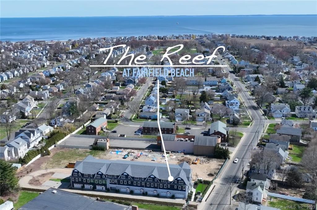 The Reef at Fairfield Beach Model Townhome is ready to impress, 3530 sq. ft., 5 bedroom, 4 bath townhome style condo with private elevator. Enter into a spacious foyer with access to the 2 car garage, elevator and a flexible space that could be a en-suite bedroom, office or media room. The main level is professionally designed with an open floor plan, gourmet white kitchen with beautiful quartz countertops and an oversized island complimented by stainless Viking Appliances. The kitchen opens to the light filled living room. Two sets of sliders lead to the generous veranda for outside enjoyment and entertaining. A bedroom and full bath complete the main level. The upper level has the primary bedroom with 2 generously sized walk in closets, luxurious bathroom with soaking tub and oversized shower. There are 2 additional bedrooms that share a hall bath and one has direct access to the bath. The laundry room completes the upper level. In town living at its very best! Easy stroll to Fairfield Center Metro North, shopping and dining, Fairfield Theater Company, Town Green and all that Fairfield has to offer. Just a 5 minute bike ride to Penfield Beach on spectacular Long Island Sound or a 5 minute walk to Town. There are 8 townhomes available in the complex and there is still time to customize.