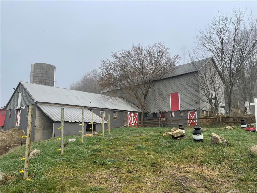 New England Farm awaits! Gorgeous open fields! Large barns! 2 car garage! New hot water heater, oil tank, and updated electric! You New England gentlemen/ladies farm awaits You!