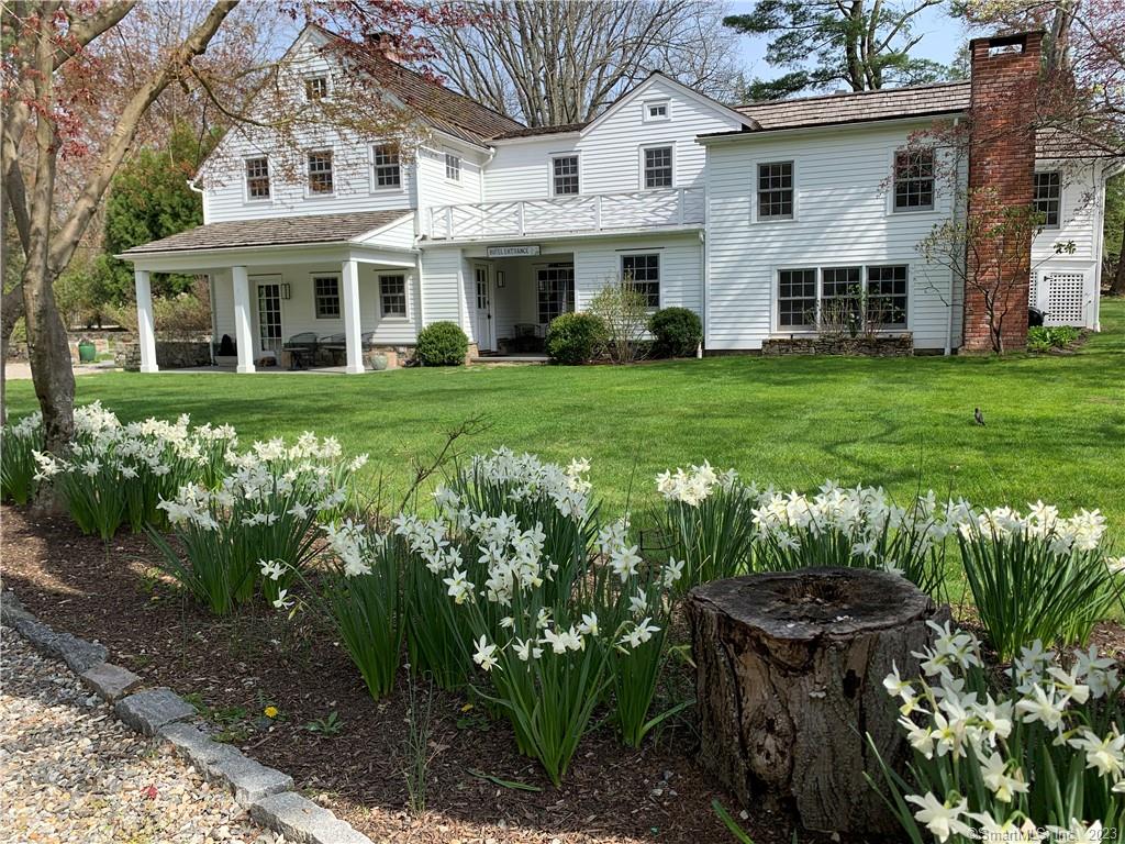 Idyllic and charming country home with beautiful grounds in Old Hill section of Westport, perfect for a splendid summer with family and friends. This award winning completely renovated 150 year old plus farm house is elegant and sophisticated, yet provides a unique sense of simplicity and warmth. Open floor plan with expansive dining and living rooms, and chef's kitchen. Lots of windows with abundant light and spectacular wide plank antique oak floors throughout. Large patio for eating and relaxation with views of gardens and carriage house. Four bedrooms with three full baths and one half bath. Child friendly. Two covered porch areas with views of Nash's pond. Ten minute drive to railroad station (one hour+ to NYC), Compo Beach and Longshore for tennis, golf or sailboat and kayak rentals (fifteen by bike), ten minute walk to downtown, five minute walk to Earth Place and Wadsworth Arboretum walking trails. Surrounding properties and homes are beautiful and charming with equally great neighbors that give this place a rarely found bit of magic and community. Add a home wide Sonos music system and a backup generator powered with gas from the street and this property provides everything the discerning renter might desire.