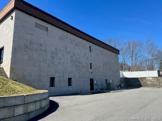 BASEMENT space for lease. Upper level currently occupied by site work contractor/property owner. Great location, easy access to I84, Route 25, Route 302. Available space has approximately 3, 000 square feet with its own private driveway, (has 2 entry/exit doorways), 2 bathrooms, separate paved parking area, and some natural light. This area has a full sprinkler system and is very spacious. Most recently used as office space with large partitioned offices, separate conference room, and small break room. Owner will consider many options - would be great for architect space, printing/reproduction, machine shop, engineer, inventor/warehouse storage, parts distribution...The lease includes ALL UTILITIES as well as lawn maintenance and snow removal! Quiet location with easy access. MANY POSSIBILITIES!