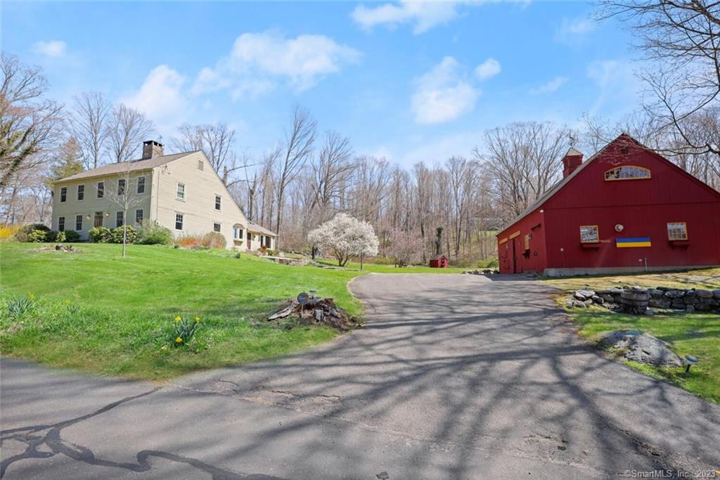 OWN A PIECE OF HISTORY! Circa 1750 Colonial/Saltbox 3/4BR w/all the charm & history of a bygone era yet updates & upgrades for today's modern buyer! *4 Fireplaces *Original Chestnut Floors *Wood ceilings *STUDIO/Barn/Garage built in 2000 *Situated on a beautiful LEVEL 3 acre parcel, STUNNING GreatRoom has FOUR sets of sliders w/2 story windows to capture the natural surroundings and vaulted ceiling w/skylights, granite fireplace, bay window & access to bluestone patio. Spacious FORMAL DR 22x18 with French doors, chestnut floor, stone fireplace & beamed wood ceiling. Incredible space for entertaining! Kitchen w/granite, island, stainless steel appliances & eating area w/bay window. Formal LR can be found in the front of the house w/wood beamed ceiling, chestnut floor & fireplace. Main flr office/possible 4th BR also has wood beam ceiling, chestnut floor, fireplace & beautiful custom built-ins. 1/2 bath/main flr laundry * Primary BR on 2nd flr has vaulted ceiling w/skylights, built ins, & full bathroom w/double vanity & glass door tile shower. 2 add'l BRs on this floor plus full bath. STUDIO *2 STORY POST & BEAM 1800sf (incls 800sf 2nd flr) w/sliding barn doors, propane gas, upgraded electric! Ideal Flexible Space for your interest! Opportunity to enjoy gardening * Hobbies * Picture perfect yard *Stone walls *Bluestone patio! Major renovation in 1980s to include updated septic. One Mile from Jackson Cove Town Park, sandy beach, kayak, boating & Quarry Walk new shopping center