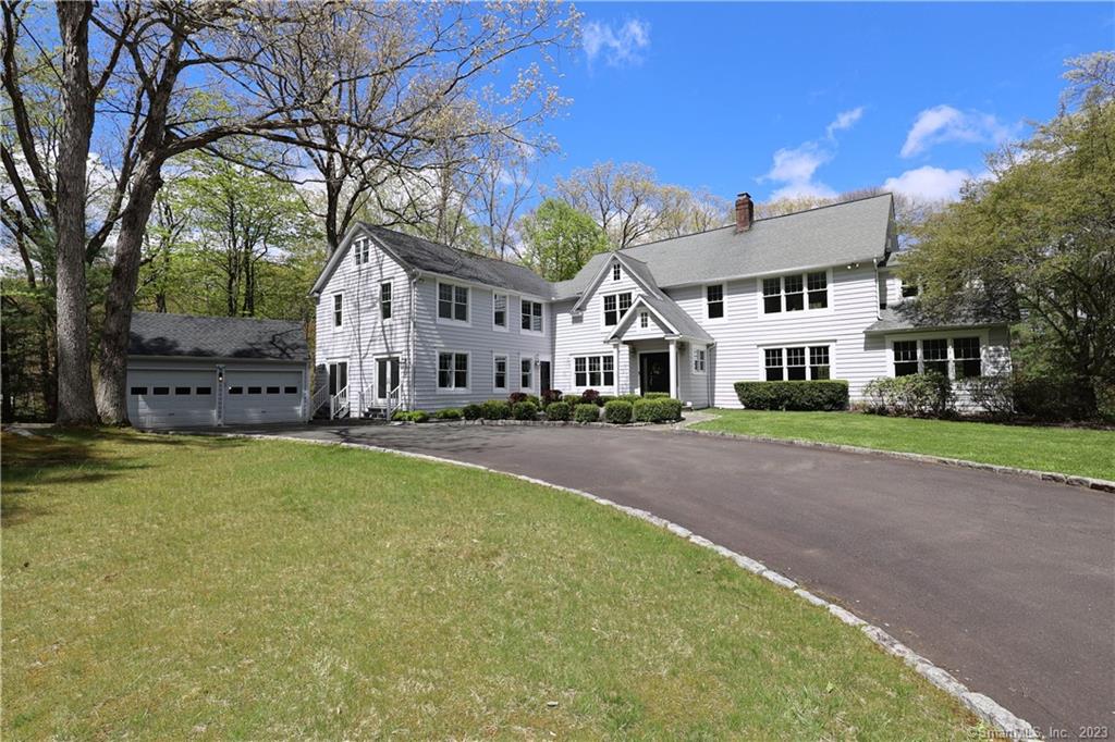 Sophisticated country estate set back privately on 3.7 park like acres w/stone pillared gated entry, Belgian block lined circular drive, majestic trees, stone walls, covered slate porch overlooking the expansive bkyd, plus scenic waterfront setting along the Norwalk River. This exceptional home was originally built in 1936 & extensively renovated/expanded w/5, 582 sf, 7-9 BR, 4/1 baths, front/back stairways, plus 2 walk-up bonus rooms on the 3rd floor. Elegant slate vestibule entry w/French doors to the gracious foyer, newly refinished hdwd floors, & custom moldings/wainscot. Light & bright w/generous rooms for entertaining including the inviting LR w/custom fplc surround, French doors to the rear porch, & open to the adjoining conservatory. Enjoy large gatherings in the formal DR or casual meals in the updated chef's kitchen w/timbered vltd breakfast room, French doors to deck, prof. gas range top w/hood, wall oven/warming drawer, plus new fridge featuring glass view door & Craft ice maker! Separate wing w/private entry to a 32' family/media room plus adjoining bedroom/office with J&J bath & back stairway, also ideal for private in-law/guest quarters. The 2nd floor features a playroom/den & up to 7 more BR including the lux primary suite offering French doors to the sitting room & updated bath. New top of line Buderus 5 zone hydro air system, top commuting location just moments to Branchville station, 1000' riverfront stocked w/trout for fishing, yet only 52 miles to Midtown!