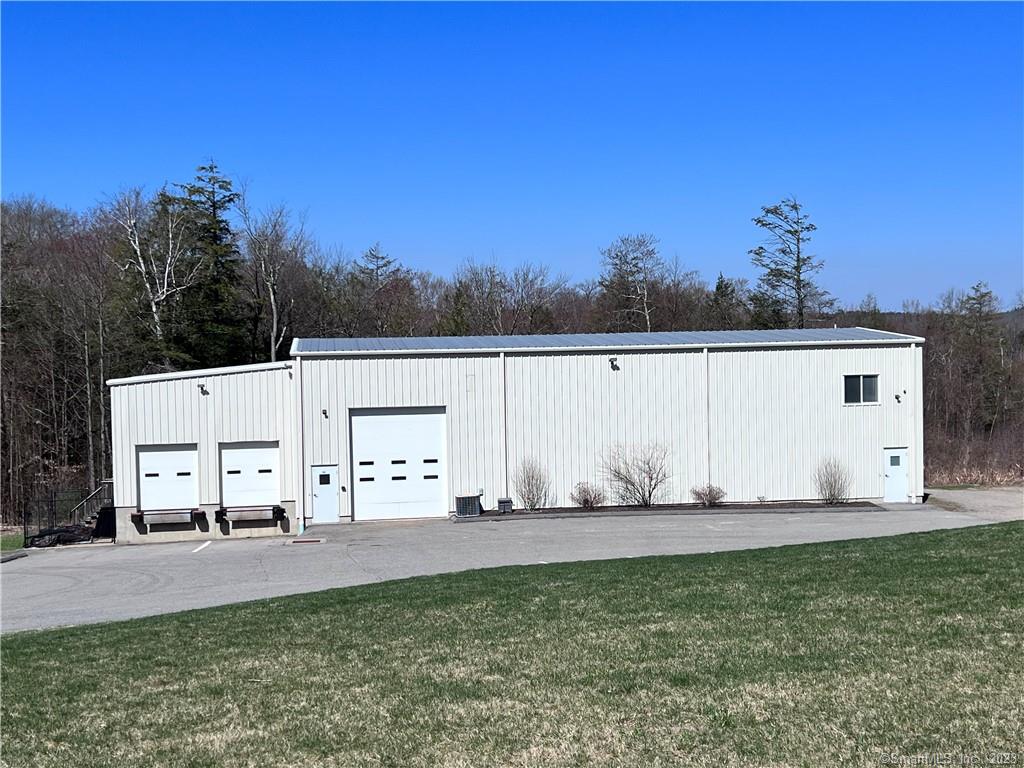 This may be one of the last industrial properties available in Torrington. There is a steel building that sits on 3.79 acres, was built in 2013 and boasts 3200 sq. ft. of warehouse/industrial space with a 15 foot overhead door, 2 door loading docks, 960 sq. ft of office space that includes 1 full and 1 half bath along with a kitchen/break room area. Outside there are several, level graveled areas that provide plenty of outdoor storage and room for another 6, 000 sq. ft. building and possibly even another smaller one. The buildings mechanical and energy saving features are insulated walls and ceiling inside the metal framing which includes the loading dock area, insulated overhead doors and the entire office area. The office is heated and cooled by Mitsubishi Hyper Heat ductless unit. Warehouse is heated by natural gas hanging unit and cooled with central air system. The warehouse features 3 phase electrical power with an additional line pulled for future needs, there are several high amperage outlets located in and outside the building. The building is ideally situated and set up for an e-commerce, manufacturing or warehouse facility with easy access to Rte 8 and 44.