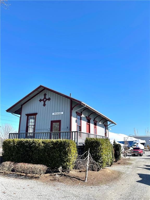 Looking for a nautical place to put your business? This office building has two sunny, large rooms with high ceilings and a waiting area and private bathroom. Take a break and walk outside to your porch overlooking the boatyard. Idea for those in the maritime trade (boat brokers, marine insurance, etc). Come make Noank your home. Owners prefer marine use.