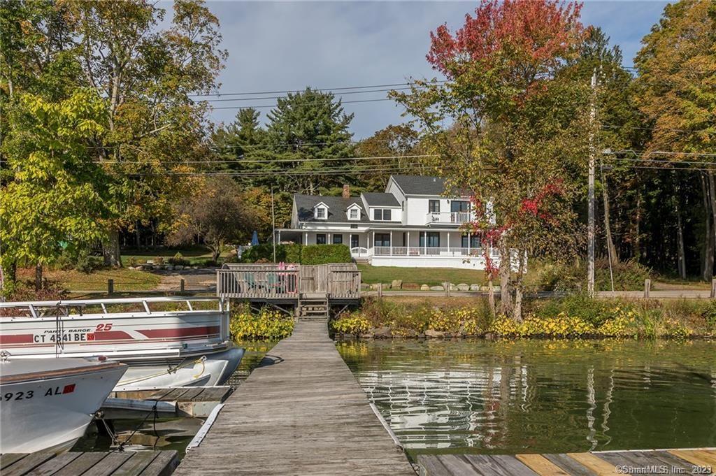 Bantam Lake 4BR/4B Colonial available starting September 3rd for annual rental of $5, 500 /month with use of the dock on the Waterfront Parcel across the street at CT's largest natural lake. Once a modest antique, this 3100sf home filled with character and styled for modern living, had evolved in to a true lake home beauty in 2015 when it was tastefully crafted with a 1600sf addition by a master carpenter....and now with a newer kitchen with stainless steel appliances and granite tops. Enjoy lake living at it's best on the wrap around and covered mahogany deck, fire pit area on the terrace or simply in the comfort of this chic home with commanding lake views from almost every window. The primary bedroom suite offers hardwood floors with French doors opening to the Juliet balcony, a huge walk-in closet and bathroom with a luxurious soaking tub, tiled shower, double sinks and stone tile floors. Come enjoy the various activities Bantam Lake has to offer throughout the year: swimming, boating, water skiing, fishing, ice skating & more! Hike or bike the 4, 000 acres of White Memorial right in Morris, Steep Rock in Washington Depot or Topsmead State Park in Litchfield.