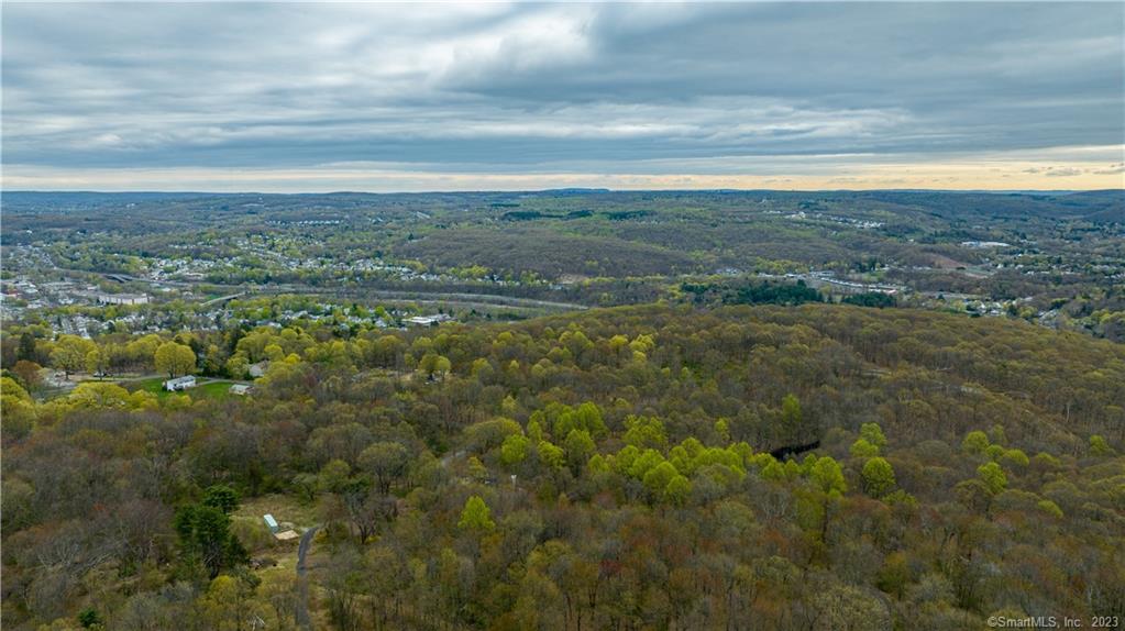 Rarely available opportunity to own 36 Acres of Square, level, and mostly cleared land that borders State Land, public water hook up, almost 150 feet of road frontage, and a possibility to subdivide into 22 lots. Property is currently gated and has a barn with a beautiful stone fireplace in the center. Lots of flexibility and potential for the price per acre. Buyer to do their own due diligence with the town. Also listed for rent MLS 170564174.