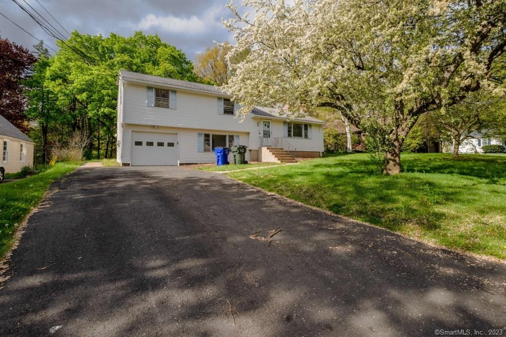 Multifaceted home located in the award-winning West Hartford school district on a huge half acre+ (.35) lot. Home has 3bed/4bath split level The town card calls this a 7-room home, but it is a 9-room home. With a large bonus room off the back of the home that gives you amazing flexibility. Which could be used as in-law suite, an office or a playroom. It comes with an additional family room on the ground level of about 350+ square feet of additional living space not included in the town square footage. With a separate entrance. Still need more space? The basement is already framed and ready to finish into a terrific rec room. This home has abundant closet and storage space. There are hardwood floors in all bedrooms, there is gas on the street, so a conversion to gas heat would be easy. A stone throw is Eisenhower Park and Wompanaug Country Club.