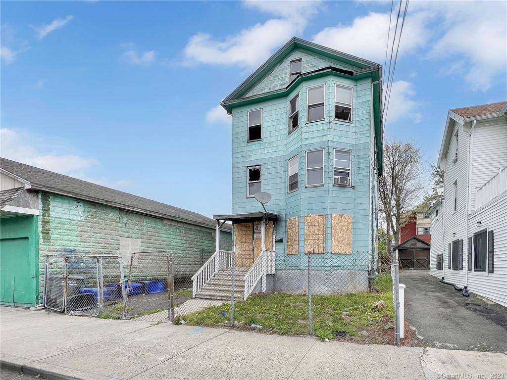 This is a rare opportunity for investors to take on a large and prestigious 3-family and huge warehouse space located in the East End of Bridgeport, now available for purchase. While the property is in need of a full renovation, it has been secured and cleaned of all debris, giving investors a blank slate to work with. With its prime location and potential for a high return on investment, this property is ideal for those looking to take on a challenging yet rewarding project. Please note that buyers will be responsible for due diligence.