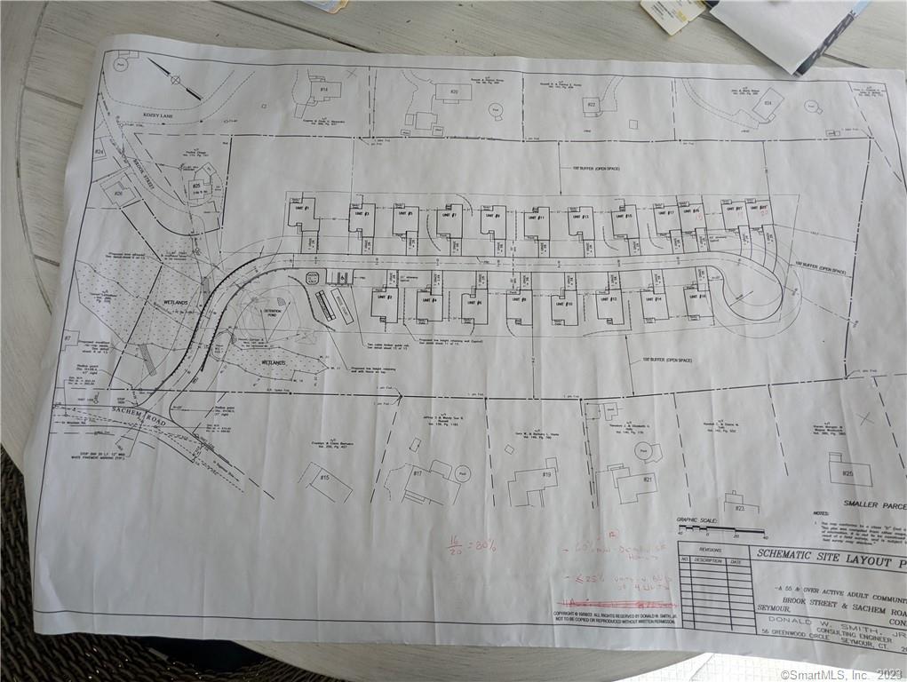 Large parcel with proposed 18 lots for 20 units. Lots of possibilities to build amazing subdivision in desirable location at the end of quiet street. Water and sewer available in area. Buyer to do due diligence.