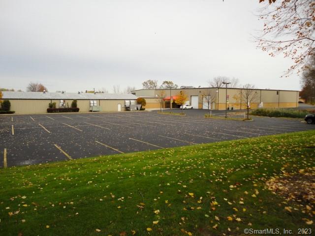 Available for lease immediately and conveniently located just minutes from Bradley International Airport. Approximately 15, 551 square feet of open warehouse space with 18' clear on the edges and 20'-6 clear in the center. The space features two 14' drive in doors and one additional drive-in door at 8'. The warehouse is 112' wide by 154' long. Gas heaters are throughout the space. Offices overlook the warehouse space. Electric power is 2000 amps to the building with 480/277/220 volts available. The fully sprinklered building also has ample parking available. Easy access via: Rt-75, Rt-20, I-91 & I-90.