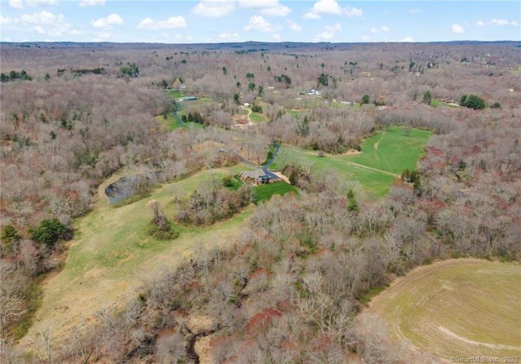 This 32 acre parcel of beautiful forests and tilled fields of farmland provides numerous opportunities including estate building, development and continued farming. Entering the property along hundreds of feet of frontage along Wauregan Rd. Property is adjacent to Blackwells Brook Farm at 371 N. Canterbury Rd. (MLS #170560805). Roads and pathways lead past streams through woods opening up to hills, valleys and well-maintained fertile fields. Large potential gravel deposits could also provide income with development to follow. This beautiful piece of land is available right now separately or in combination with two other adjacent properties. All three parcels add up to just over 157 acres.