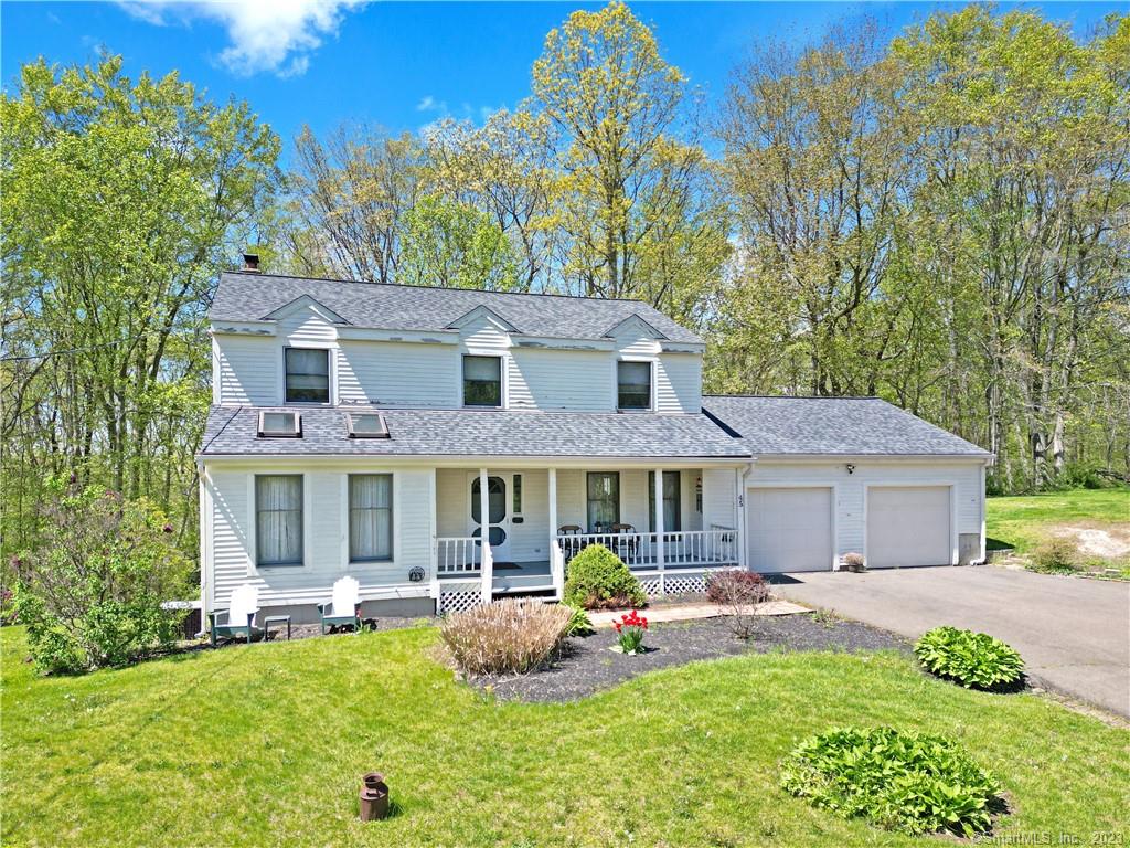 This 4 bedroom, 3 full bath colonial fits perfectly in this pleasant North Branford neighborhood. The front porch faces East, which provides hours of sunlight and relaxation. Starting on the first floor, you have timeless wide wood plank flooring, a spacious dining room on your right and a cozier space with skylights on the left which can be used as an office or formal living room. Next we have a large living room which flows to an eat-in kitchen. Heading to the back of the house, a three season room with an exit to a large back deck, all ideal for entertaining. On the second floor, the primary suite has a full bath and roomy walk-in closet. There is another full bath in the hall for the three additional bedrooms. The large, walk-out basement has high ceilings with much potential for finishing and 2 car garage. Schedule your showing today for this beautiful 1.96 acre property! House being sold As-Is