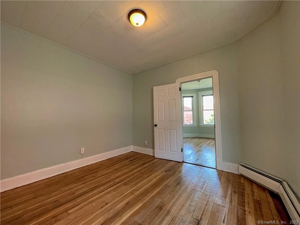 Beautifully remolded 2nd Floor 2 Bedroom Aprtment now available. This apartment also has a brand new Kitchen, new Hardwood Floors, Private Back entrances with private off street parking. Spacious and bright this apartment will not last long so schedule showing today!