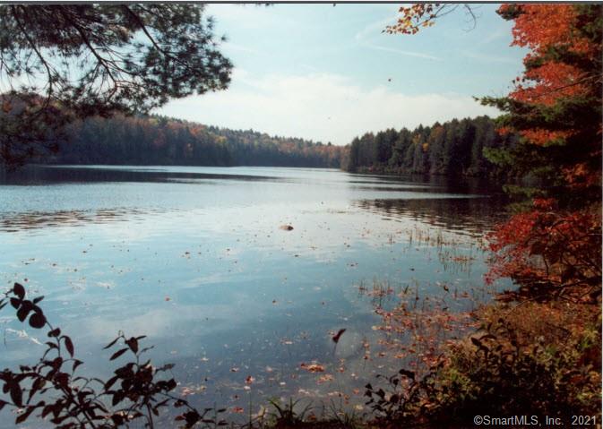 50 ACRE SECLUDED LAKE ON 644 ACRE WILDERNESS TRACT including 3 smaller ponds, 2 streams in Connecticut's quiet Northeast corner. Absolute peace, quiet and security with no public access. With 9, 000' of direct water frontage, the lake affords numerous building sites some with sunrise/sunset views along with private boating, swimming and fishing. For the nature lover, this is heaven on earth with abundant wildlife, no traffic noise, unparalleled star gazing. Miles of gravel roads provide vehicular access to the interior hidden lake and ponds. For the developer, the entire tract is approved for 135 cluster lots (30 lots in Phase 1 completely engineered). Zoning regulations allow and recorded engineering data indicate the feasibility for various other uses including family compound, large estate lots, recreational, corporate headquarters, etc. Seller options: 240+/- acres with 15 acre pond $2, 500, 000 (Listing # 170604362) or 400+/- acres with big lake and 2 smaller ponds $4, 500, 000 (Listing # 170604053). Distance to Providence 20 miles, Foxwoods Casino 30 mi, Hartford 45 miles, Boston 55 miles, New York City 145 miles. Several major airports are within one hour's drive. Local airstrips are also available for smaller aircraft.